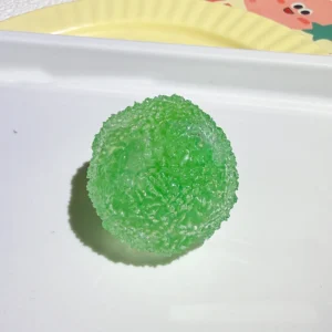 Rozciągliwa kulka mochi do ściskania — miękka zabawka antystresowa squishy Zielony fluorescencyjny
