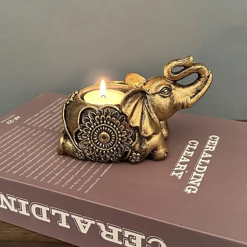 Świecznik na tealight słoń z uniesioną trąbą — figurka dekoracyjna Złoty