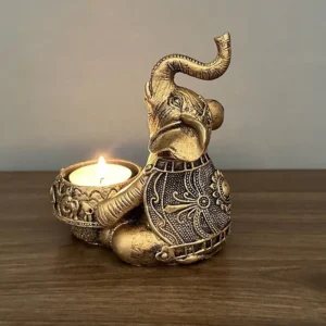 Świecznik na tealight słoń z uniesioną trąbą — figurka dekoracyjna żółty