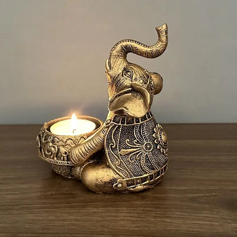 Świecznik na tealight słoń z uniesioną trąbą — figurka dekoracyjna żółty